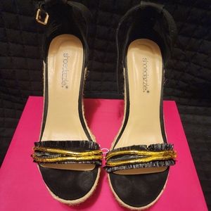 Size 7.5 summer wedges. Might need a little love.